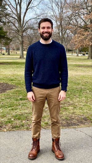 The photo it started from: a bearded man in a navy sweater standing in a park
